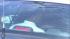 Wild car chase: Money thrown out SUV windows :: A bank robbery suspect is seen in the back of a police cruiser after a wild chase that ended in South Los Angeles on Wednesday, Sept. 12, 2012.