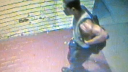 A still from surveillance video shows a burglary suspect at a shop in Beverly Hills on Sunday, Sept. 23, 2012.