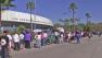 A crowd is seen waiting to receive wristbands for a free health clinic at the LA Sports Arena on Monday, Sept. 24, 2012.