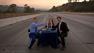This trio set up a dining table on the empty I-405 Freeway during Carmageddon in 2011.