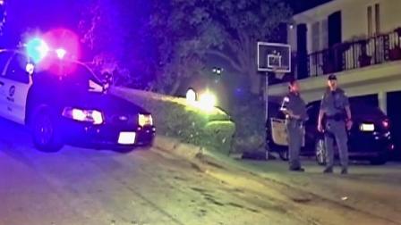 LAPD officers arrive to the 8100 block of Mulholland Terrace after a homeowner reported a number of cars burglarized in the area early Thursday, Sept. 27, 2012.