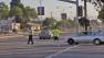 A man is seen guiding traffic during a closure for the L.A. Triathlon on Sunday, Sept. 30, 2012.