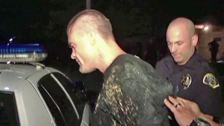 A suspect, identified as Nicholas Campos, is shown being taken into custody for allegedly beating and stabbing two people in Pomona on Tuesday, Oct. 2, 2012.