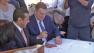Los Angeles Mayor Antonio Villaraigosa and AEG President Tim Leiweke sign the implementation agreement to build Farmers Field on Wednesday, Oct. 3, 2012.