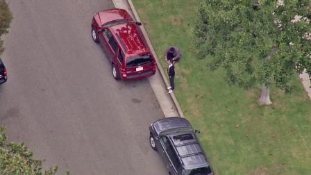 Two cars are shown at the scene of a heist involving $200,000 worth of jewelry in Santa Monica on Tuesday, Oct. 9, 2012.