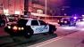 Police patrol vehicles are shown near the scene of a shooting on the 700 block of East Providencia Avenue in Burbank.