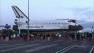 Space shuttle Endeavour makes a stop at a private parking lot before continuing on its 12-mile journey to the California Science Center on Friday, Oct. 12, 2012.