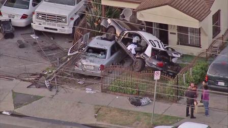 Three Los Angeles Police Department officers were injured Friday afternoon when their car crashed into a front yard in South Los Angeles on October 12, 2012.