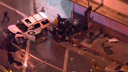 Authorities are seen at the intersection of Franklin and Cahuenga in Hollywood where a brief pursuit came to a crash ending on Friday, Oct. 12, 2012.