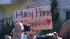 A young girl holds a sign welcoming space...
