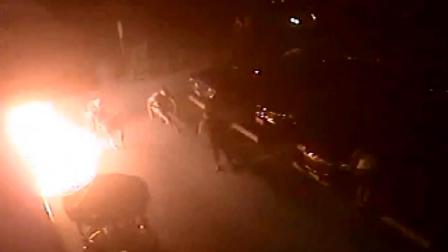 This still image from surveillance video shows a man being set on fire by someone with a Molotov cocktail outside a market in Long Beach on Friday, Oct. 19, 2012.