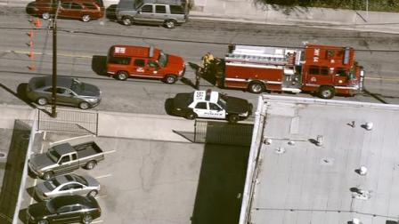 Fire and police vehicles are shown at the scene of a shooting at a fire protection business on Cleta Street in Downey on Wednesday, Oct. 24, 2012.