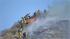 Flames doused in Santa Clarita amid wind... :: Crews are seen working to put out a fire near Soledad Canyon road in Valencia on Thursday, Oct. 25, 2012. The fire was out within an hour and no structures were threatened.