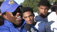 Coach Robert Garrett is seen.