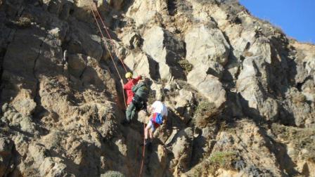 Two lifeguards who attempted to save a woman stranded 50-feet above rocks in Pirate Cove ended up getting rescued by the LA County Sheriffs Malibu Search and Rescue Team Saturday, Oct. 27, 2012.