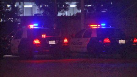 Police are seen on Foster Road in Downey after receiving reports of a man who was assaulted on Sunday, Oct. 29, 2012. The victim later died.