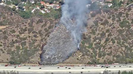 Smoke from a fire is seen on a hillside off the 134 Freeway in Glendale on Tuesday, Oct. 30, 2012.