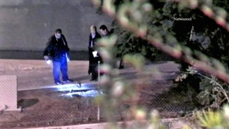 Investigators search the crime scene where a shooting victim was found in Montebello on Friday, Nov. 2, 2012.