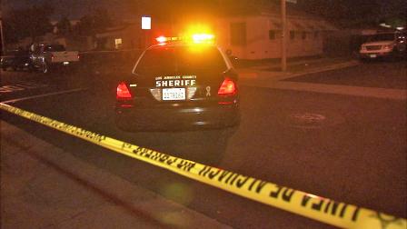 A Los Angeles County Sheriffs deputy car is seen near the 2700 block of East Madison Avenue in Carson where a mans body was found in a van on Sunday, Nov. 4, 2012.