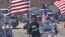 Motorcyclists carry the American flag in San Pedro to honor veterans on Saturday, Nov. 10, 2012.