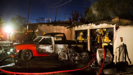 Several people are temporarily displaced after a fire swept through the garage of a home on the 300 block of Linda Rose Avenue in Pasadena Sunday, Nov. 11, 2012.