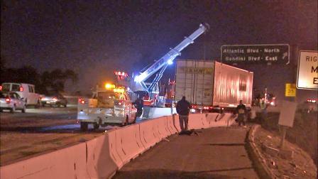 A big-rig is seen after it crashed into a wall while trying to miss a stalled truck on the northbound 710 Freeway in Vernon on Tuesday, Nov. 13, 2012.