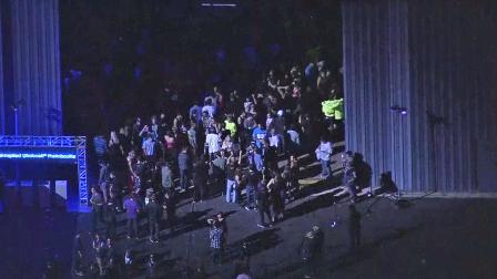 A large crowd gathers at the Santa Monica Municipal Airport for an MTV event on Tuesday, Nov. 13, 2012.
