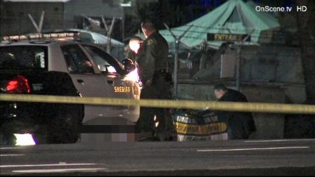 Sheriffs deputies investigate a scene in South El Monte, where a man was found shot to death in a ditch near the Whittier Narrows Recreation Area on Wednesday, Nov. 14, 2012.