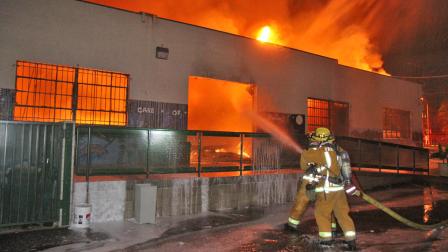 Firefighters work to put out a fire at the Opportunities for Learning charter school on the 400 block of West Montana Street in Pasadena on Saturday, Nov. 17, 2012.