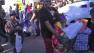 A woman and two children are seen carrying a turkey dinner supplied by the annual Jackson Limousine Turkey Giveaway on Tuesday, Nov. 20, 2012.