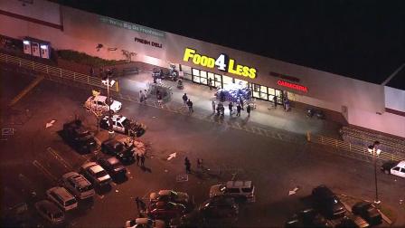 Police investigate a shooting at a Food 4 Less store in Boyle Heights on Tuesday, Nov. 20, 2012.