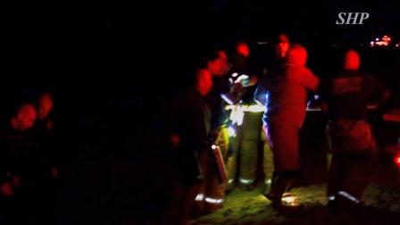 Emergency officials transport a woman on a stretcher off the Manhattan Beach Pier on Saturday, Nov. 24, 2012.