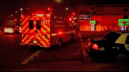 A shooting victim is taken to the hospital in an ambulance after being shot on the 110 Freeway in South Los Angeles on Sunday, Nov. 25, 2012.