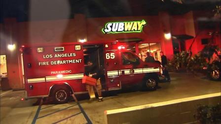 Los Angeles Fire Department first responders arrive at the scene of a robbery at a South Los Angeles Subway restaurant on Monday, Nov. 26, 2012.