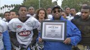 Coach Robert Garrett is seen.