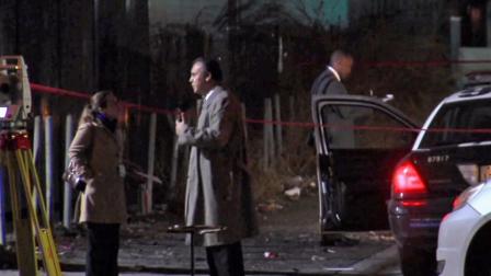 Investigators are shown near the site of a fatal officer-involved shooting in Van Nuys on Saturday, Dec. 1, 2012.