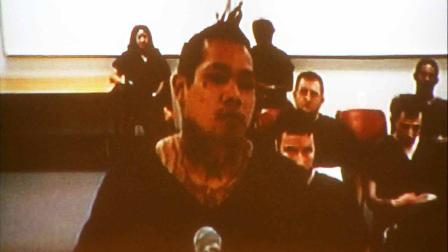 Ka Pasasouk appears on closed-circuit television for an extradition hearing in a Las Vegas Justice Court on Thursday, Dec. 6, 2012.