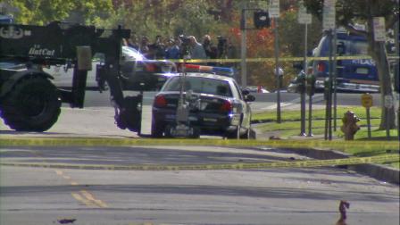 A Los Angeles police vehicle at the center of a suspicious package investigation is seen near Wilshire Boulevard Temple on Tuesday, Dec. 18, 2012.
