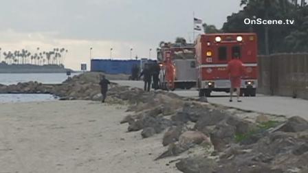 Firefighters are seen near the 600 block of Shoreline Drive in Long Beach. A man was found unresponsive near a jetty in the Long Beach Harbor Saturday, Dec. 29, 2012. He was later pronounced dead at a nearby hospital.