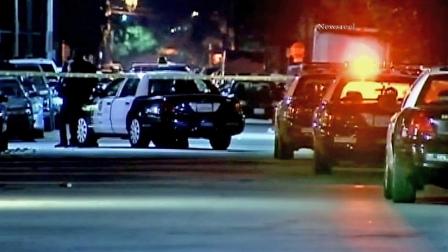 Los Angeles police cars are seen near the scene where officers shot a suspect who allegedly pointed a gun at a security guard on the 8300 block of Cedros Avenue on Saturday, Dec. 29, 2012.