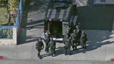 An LAPD SWAT team responds to a robbery suspect barricaded in a motel in North Hills on Friday, Jan. 4, 2013.