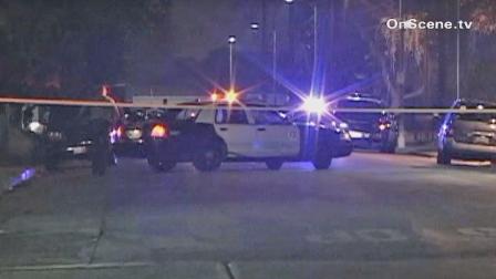 Authorities respond to the intersection of Grape and 97th Streets in Watts where a suspect was shot and wounded following a pursuit through South Gate on Saturday, Jan. 5, 2013.