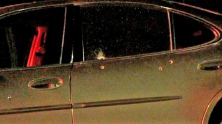Two women were injured after a car-to-car shooting in South Los Angeles on Tuesday, Jan. 8, 2013. Bullet holes are shown in the victims car above.