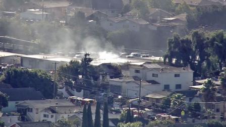 Smoke rises from the scene of a house fire in Boyle Heights on Thursday, Jan. 10, 2013.