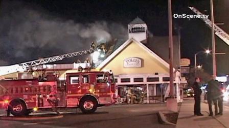 Firefighters battle a blaze at Pollys Pies Restaurant in Whittier on Thursday, Jan. 17, 2013.