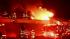 Firefighters battle a blaze at a building on the...