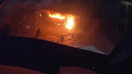 A building in an apartment complex in North Hollywood is shown on fire in this still image from AIR7 HD footage taken on Wednesday, Jan. 23, 2013.