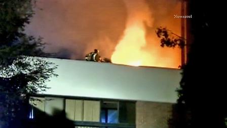 Firefighters battle a fire that broke out at a condominium complex in the 4400 block of Wilshire Boulevard in Hancock Park on Wednesday, Jan. 30, 2013.