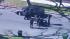 Police officers forcefully pulled a suspect out...