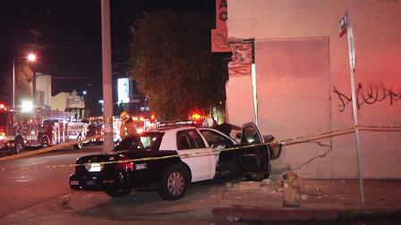 A police vehicle crashed into a building in South Los Angeles during a pursuit on Sunday, Feb. 3, 2012.